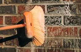 Washing efflorescence off masonry