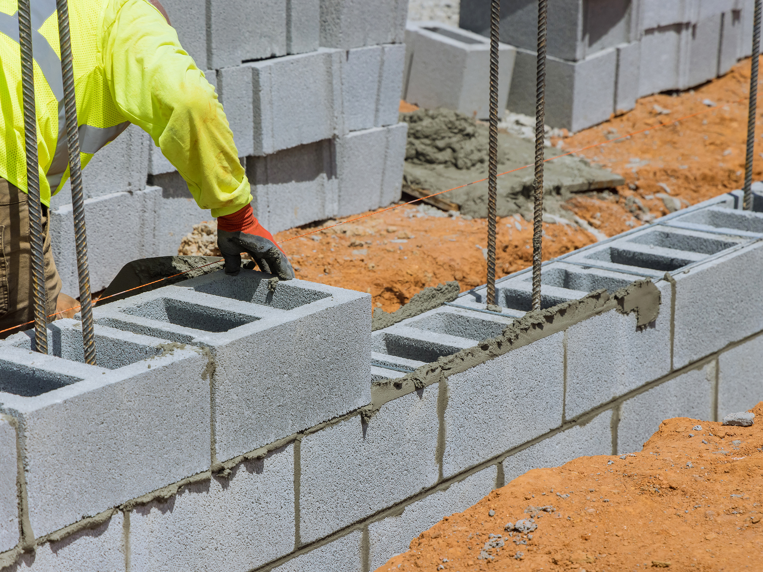 worker laying CMUs