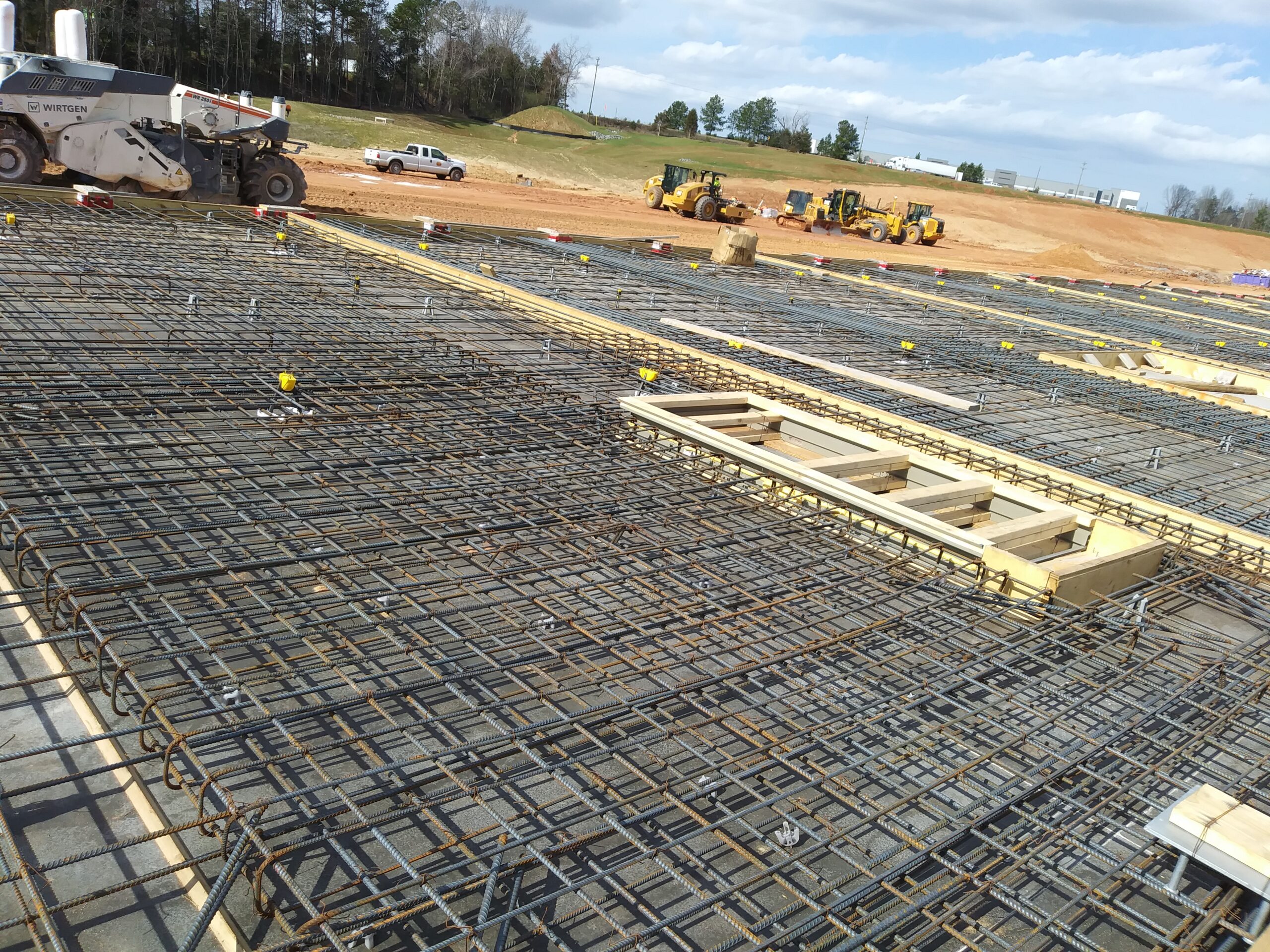 Rebar visible on a construction project site prior to concrete pour